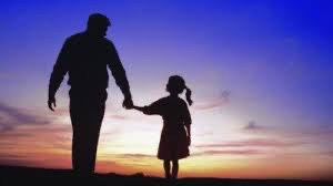 Father and daughter at sunset